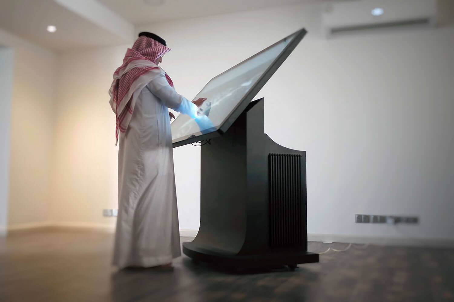 A client and a presenter at an angled CityView touch table